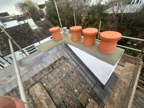 Chimney pot replacement - new chimney on a roof