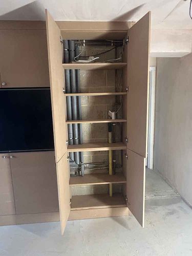 fitted-media-unit-hiding-pipework